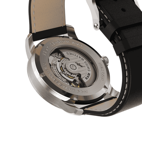 Silver wristwatch with black leather strap and abstract gold dial featuring black and white life path lines.