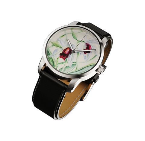 Close-up of stainless steel wristwatch with hand-painted floral dial inspired by tropical plants and black leather strap